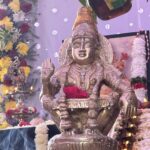 A photo of Ayyappa devotees wearing mala (Tulsi or Rudraksha beads), dressed in black or blue, carrying Irumudi kettu, or a symbolic image of Lord Ayyappa with Sabarimala temple background.